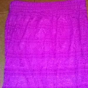 A magenta long lace skirt